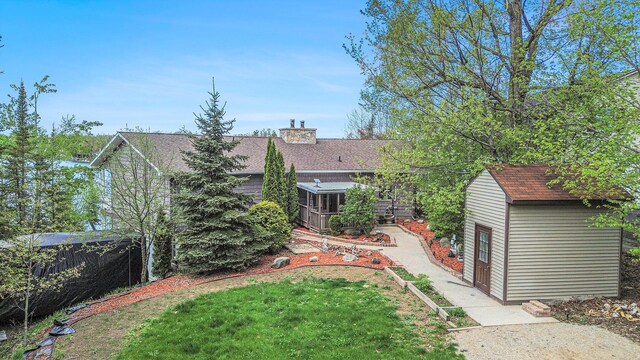 5560 Chestnut Dr, Cheboygan, MI 49721 - view of grassy yard featuring an outdoor structure