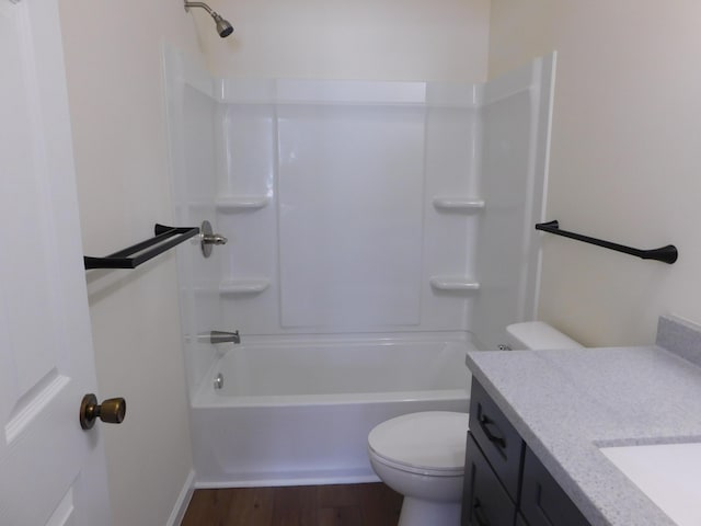 full bathroom featuring shower / bath combination, toilet, wood finished floors, and vanity