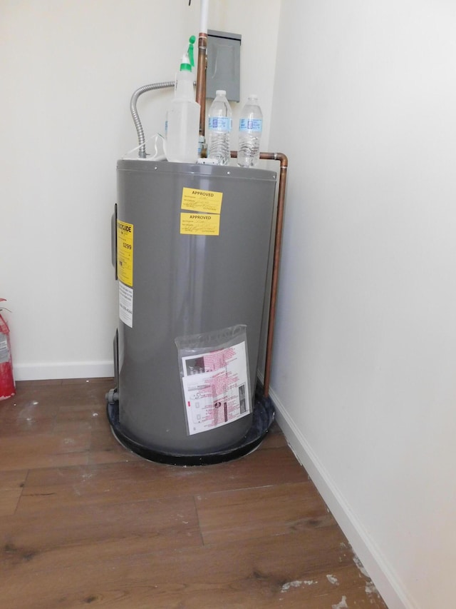 utility room featuring water heater