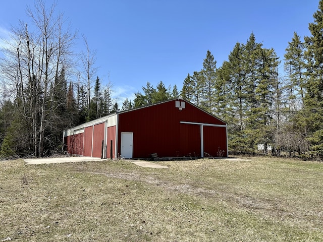 6348 Zolner Rd, Cheboygan, MI 49721 - view of pole building featuring a yard