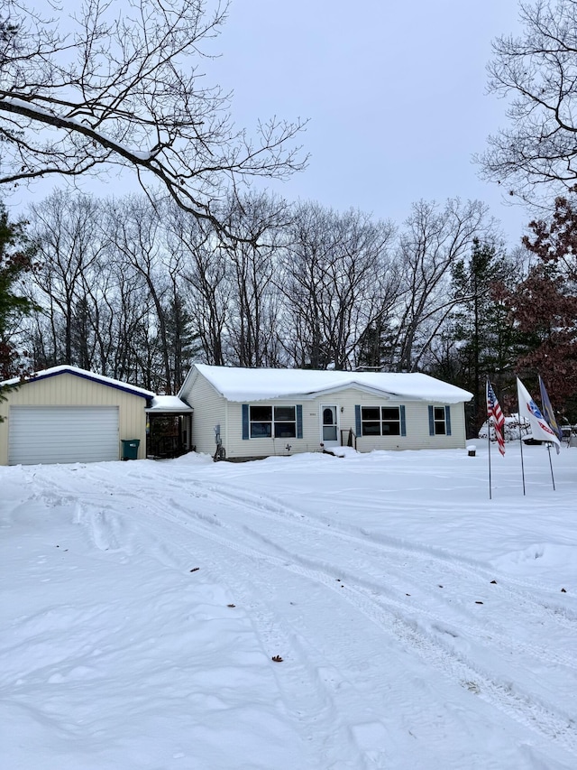 view of front facade with an outbuilding and a detached garage