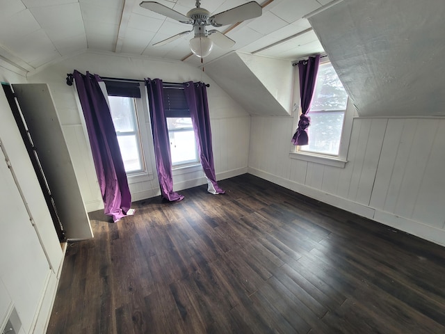 additional living space with a ceiling fan, lofted ceiling, and wood finished floors