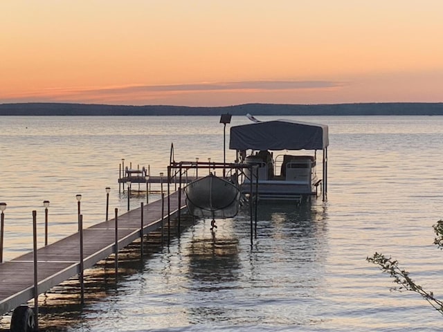 dock area featuring a water view and boat lift