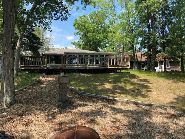 back of house with a wooden deck