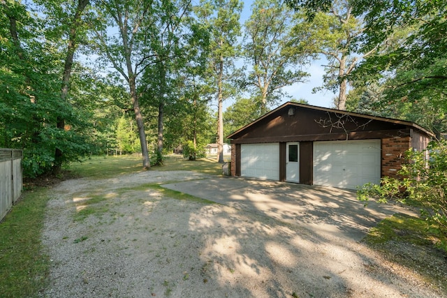 4878 S Straits Hwy, Indian River, MI 49749 - detached garage featuring fence