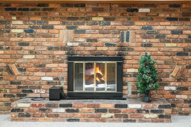 4878 S Straits Hwy, Indian River, MI 49749 - room details featuring a brick fireplace