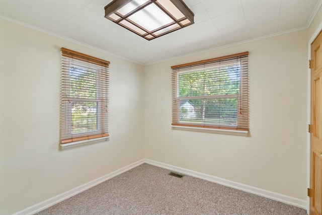 4878 S Straits Hwy, Indian River, MI 49749 - empty room featuring visible vents, carpet flooring, plenty of natural light, and baseboards