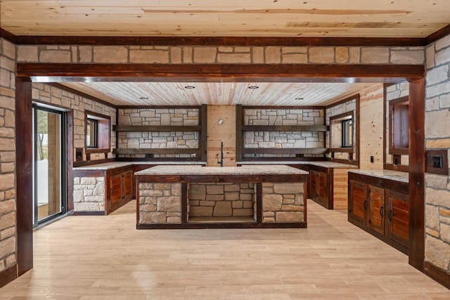 bar featuring light wood-type flooring and wood ceiling