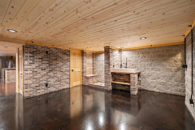 bathroom featuring recessed lighting, wooden ceiling, and brick wall