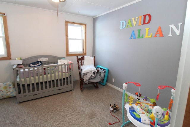 carpeted bedroom with crown molding and baseboards