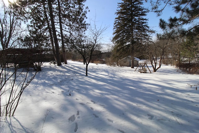 view of yard layered in snow