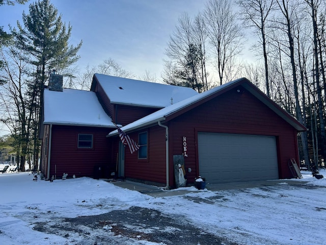 snow covered property featuring a chimney