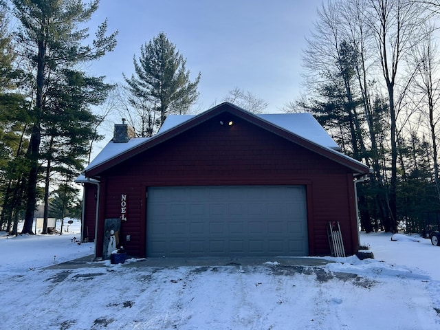 view of snow covered garage