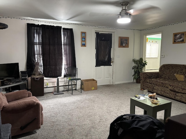 carpeted living room featuring a ceiling fan and a baseboard radiator