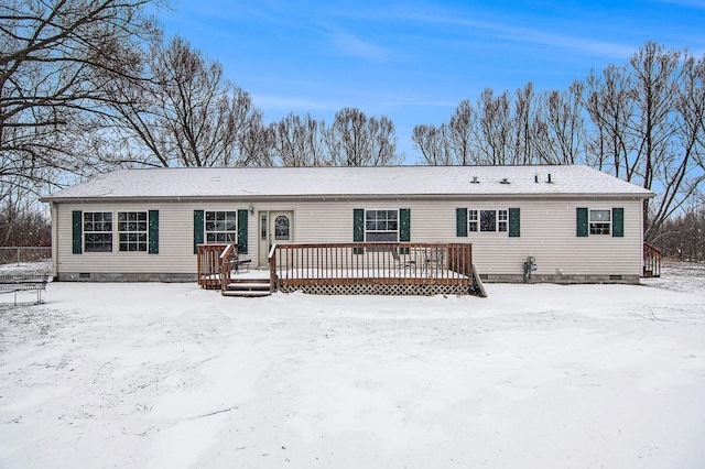 view of front of house featuring a deck and crawl space