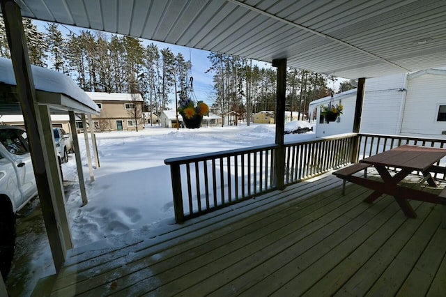 view of snow covered deck