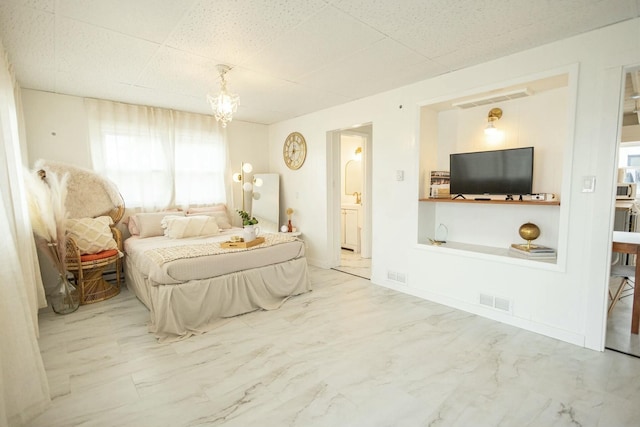 bedroom featuring visible vents, marble finish floor, and connected bathroom