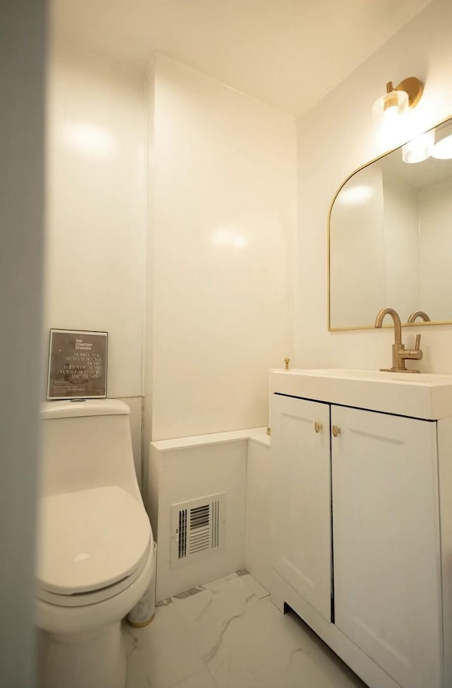 bathroom with visible vents, marble finish floor, vanity, and toilet