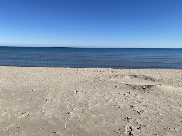 property view of water featuring a beach view