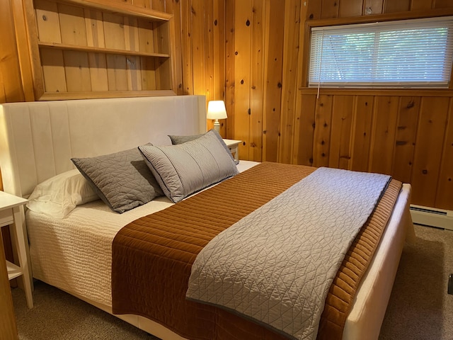 carpeted bedroom with wooden walls and a baseboard radiator