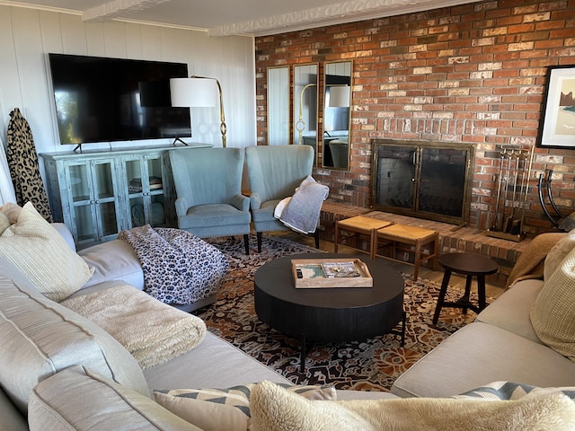 living area featuring a brick fireplace