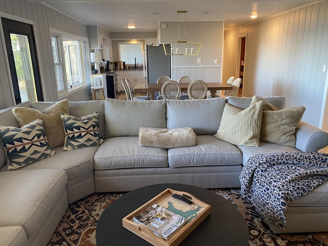 living area with ornamental molding