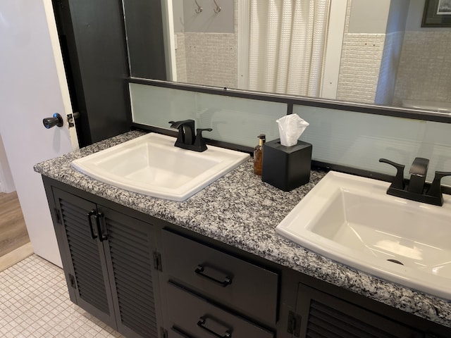 bathroom featuring vanity and tile patterned flooring