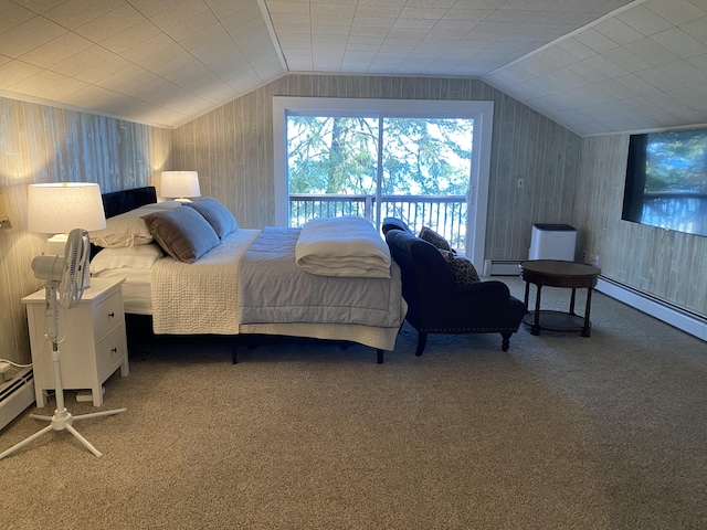 bedroom featuring wood walls, a baseboard heating unit, lofted ceiling, and carpet