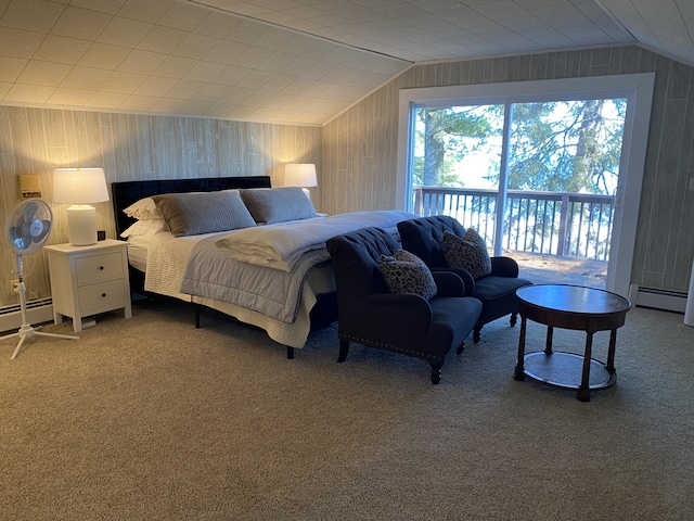 bedroom featuring access to outside, carpet, wooden walls, baseboard heating, and vaulted ceiling