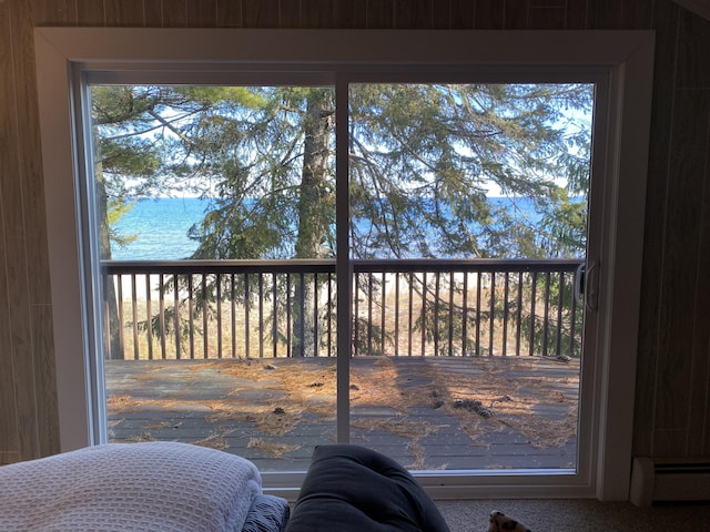 interior details featuring a water view and baseboard heating