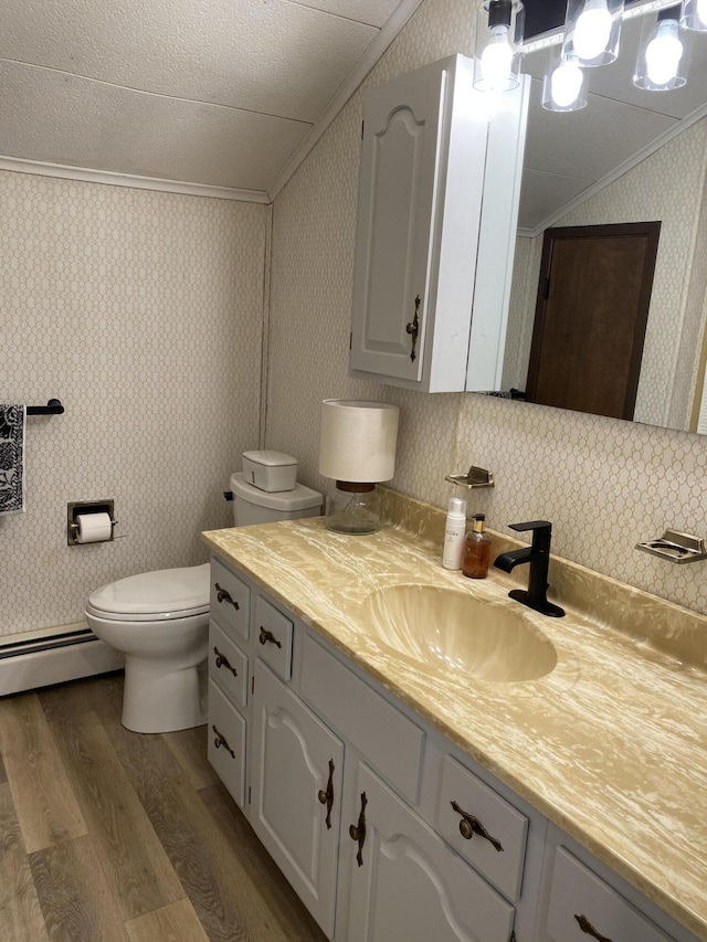 bathroom featuring toilet, wood finished floors, crown molding, wallpapered walls, and a baseboard radiator