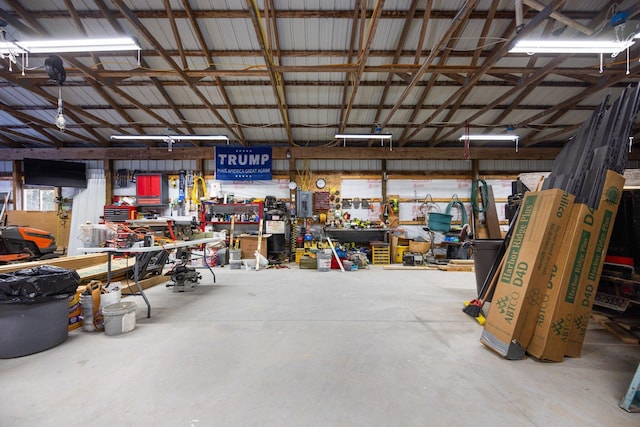 garage featuring a workshop area and metal wall