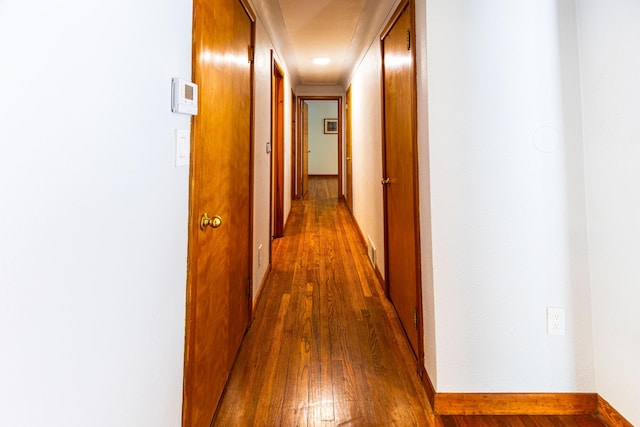 208 Stuckey Ave, Roscommon, MI 48653 - corridor with hardwood / wood-style floors and baseboards