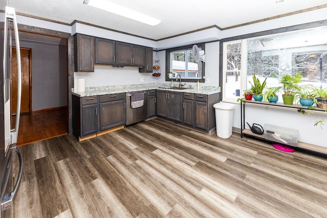 208 Stuckey Ave, Roscommon, MI 48653 - kitchen with dark wood-style flooring, a sink, stainless steel dishwasher, and crown molding