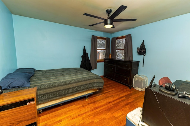 208 Stuckey Ave, Roscommon, MI 48653 - bedroom featuring wood finished floors and a ceiling fan