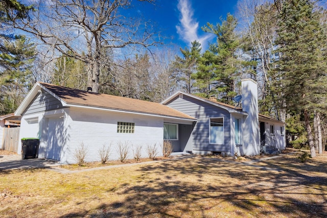 208 Stuckey Ave, Roscommon, MI 48653 - ranch-style home with a chimney and a front lawn
