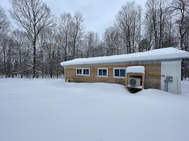 8598 N Sherman Rd, Frederic, MI 49733 - snow covered structure with ac unit