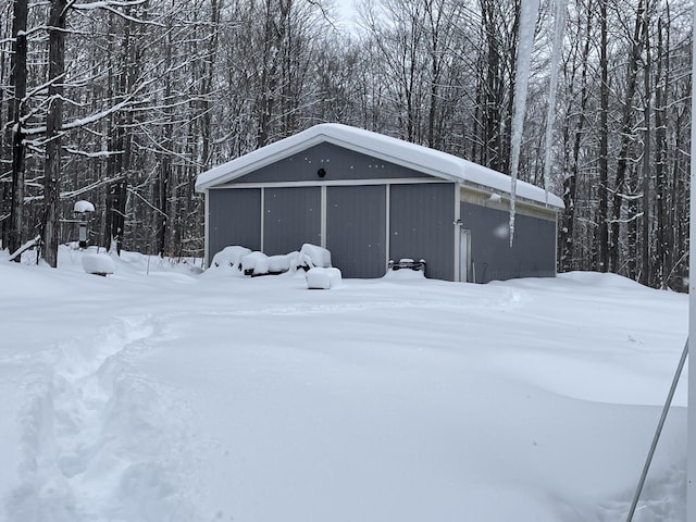 8598 N Sherman Rd, Frederic, MI 49733 - snow covered structure with a pole building