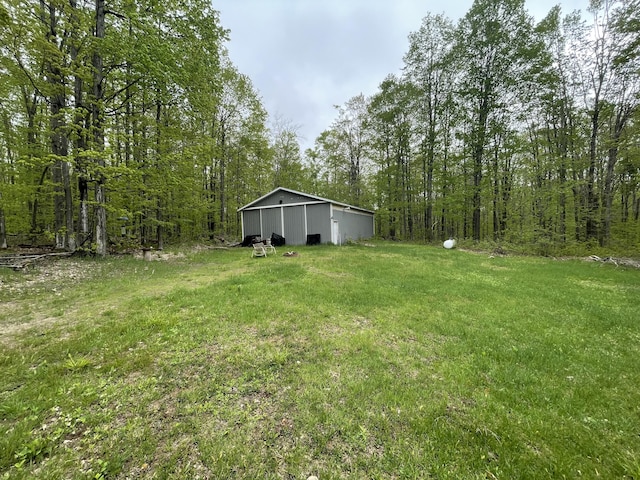 8598 N Sherman Rd, Frederic, MI 49733 - view of green lawn with an outbuilding