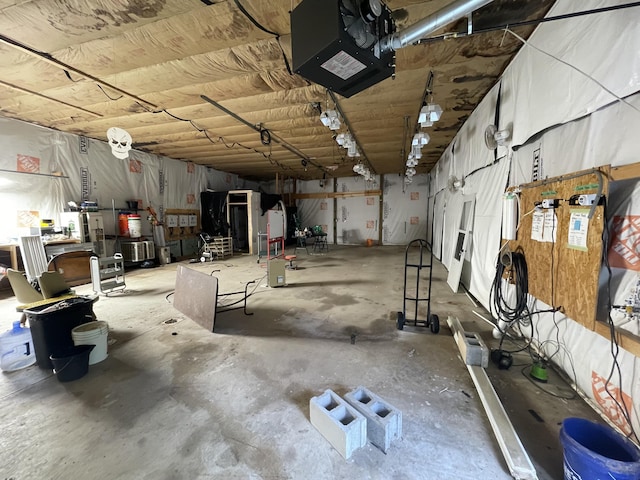 8598 N Sherman Rd, Frederic, MI 49733 - garage featuring a garage door opener