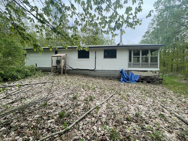 8598 N Sherman Rd, Frederic, MI 49733 - back of property featuring a sunroom