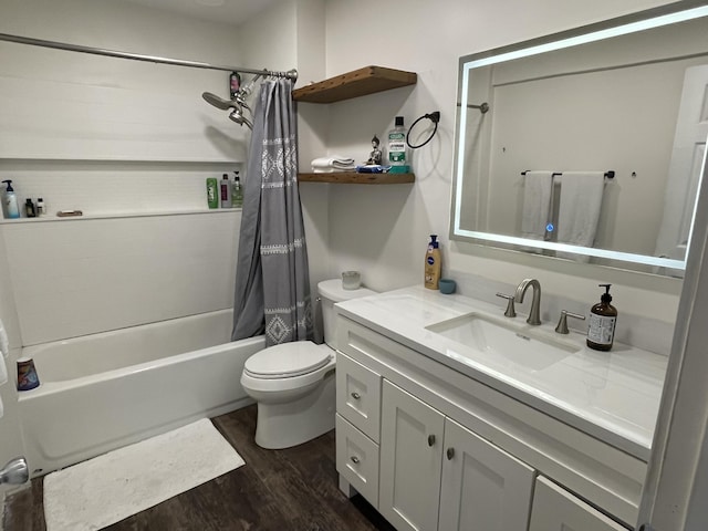 8598 N Sherman Rd, Frederic, MI 49733 - full bathroom with wood finished floors, shower / bath combo, toilet, and vanity
