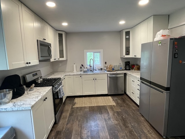 8598 N Sherman Rd, Frederic, MI 49733 - kitchen featuring stainless steel appliances, a sink, dark wood finished floors, white cabinetry, and recessed lighting