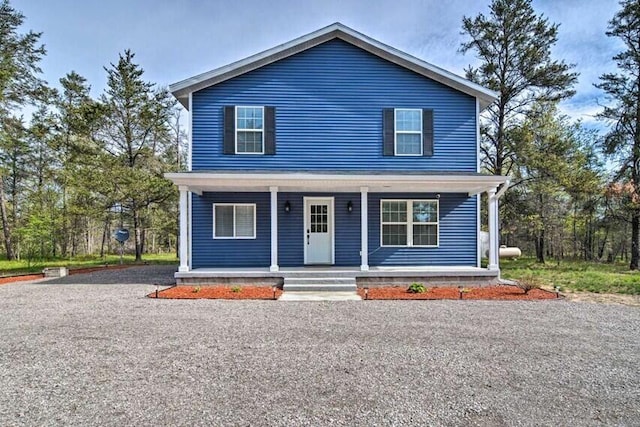 view of front of property featuring covered porch and driveway