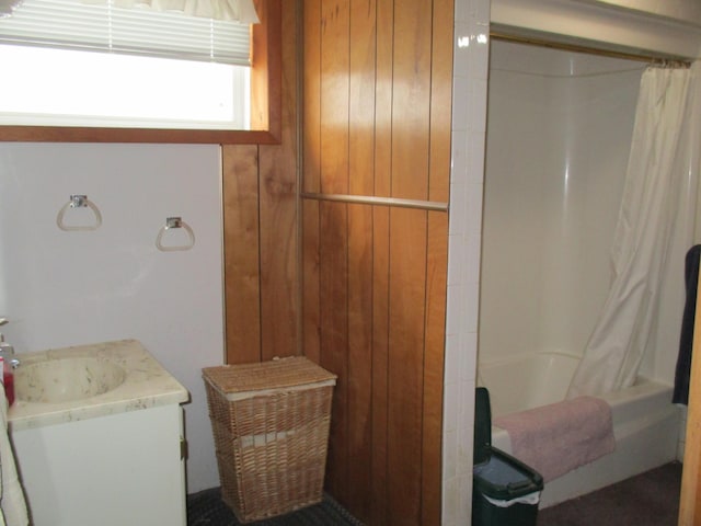 6876 Old Alba Rd, Gaylord, MI 49735 - full bath featuring wooden walls, shower / tub combo, and vanity