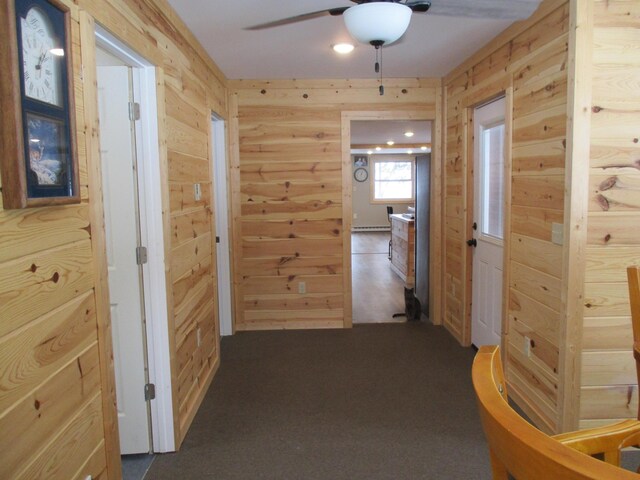 6876 Old Alba Rd, Gaylord, MI 49735 - hall with wood walls and dark colored carpet
