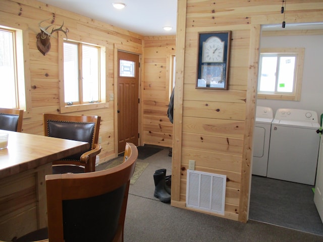 6876 Old Alba Rd, Gaylord, MI 49735 - carpeted office with visible vents, wood walls, washing machine and dryer, and a healthy amount of sunlight