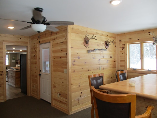6876 Old Alba Rd, Gaylord, MI 49735 - dining space featuring wooden walls, ceiling fan, and recessed lighting
