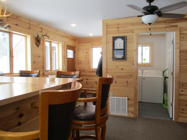 6876 Old Alba Rd, Gaylord, MI 49735 - carpeted dining area featuring a healthy amount of sunlight, separate washer and dryer, ceiling fan, and visible vents