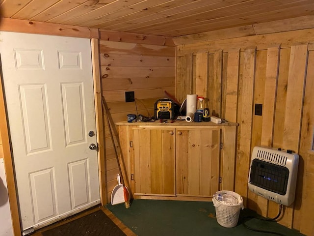 6876 Old Alba Rd, Gaylord, MI 49735 - entryway with wood walls, heating unit, and wood ceiling